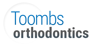 Toombs Orthodontics logo featuring blue and gray text on white background.